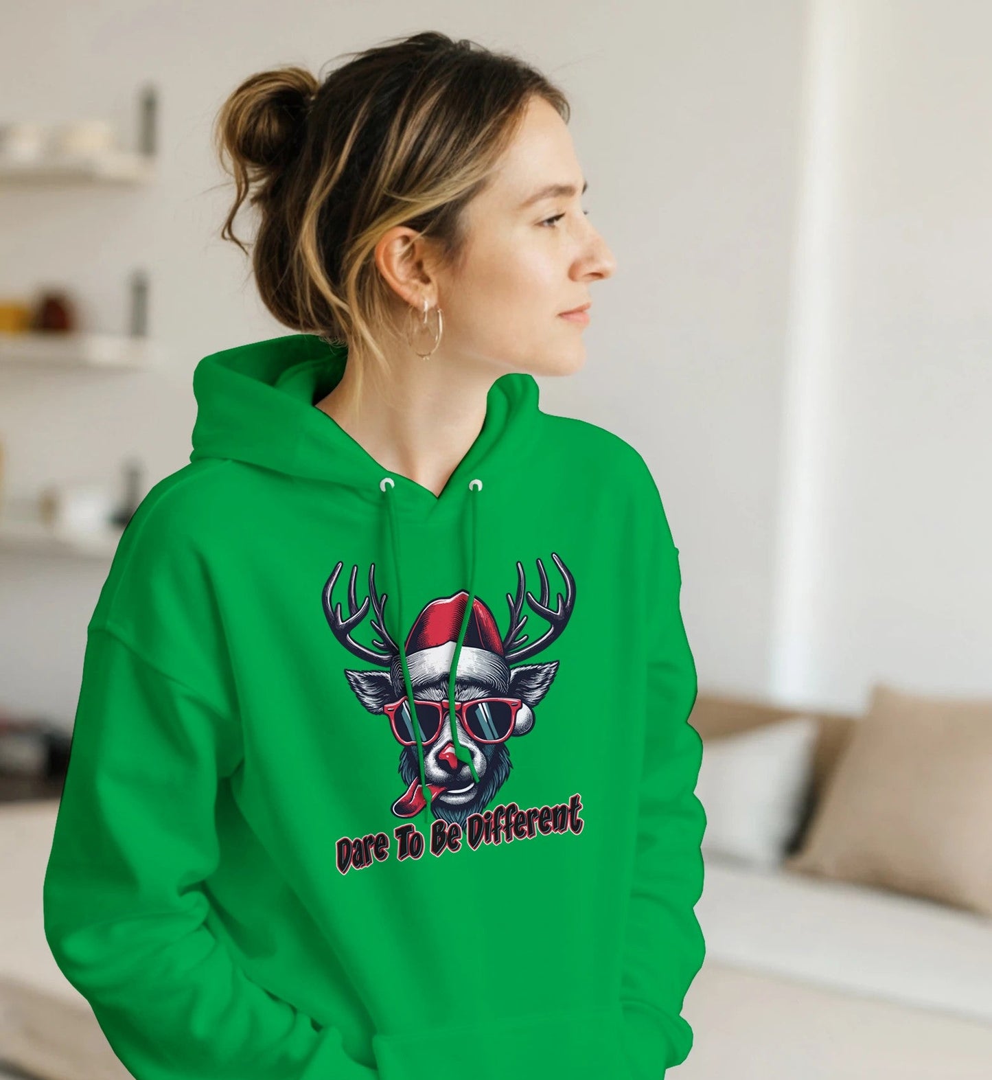 girl in a Cool Rudolph Christmas Green Hoodie with Dare to be diffent words on it.