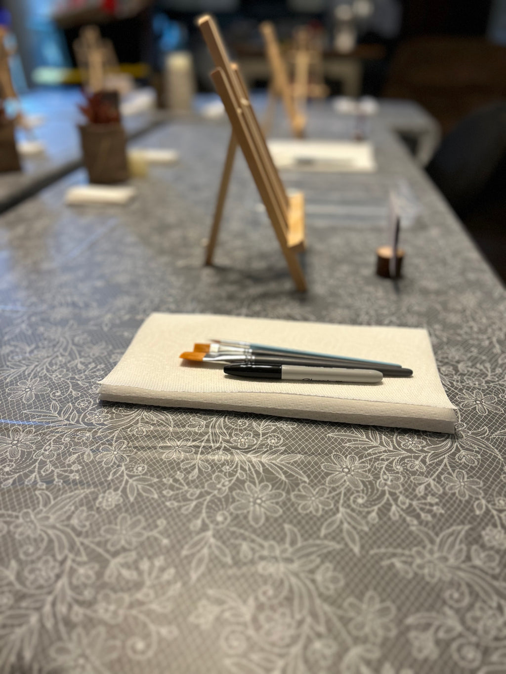 Easel with paint brushes 