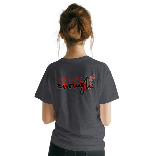 Person wearing a gray t-shirt with 'YOU ARE enough' text on the back, on a white background